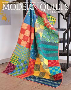 the cover of modern quilts illustrated book, featuring an image of a multicolored quilt