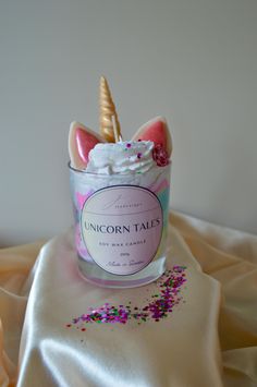 The Unicorn Tales candle is a colorful and sweet candle that is perfect for all unicorn lovers. The scent is Cotton Candy, with a lovely and sweet shade of cotton candy that takes you back to the happy memories of childhood. This fragrance has a sugary combination of cotton candy, vanilla and a slight touch of citrus. Product details: - Burning time: approx. 40-50 hours - Wax: 100% soy wax - Wick: Waxed cotton wick - Container: Glass, can be washed out and reused - Dimensions: 9 cm high and hold Unicorn Cotton Candy, Sweet Candles, Unicorn Lover, The Unicorn, Soy Wax Candle, Happy Memories, Wax Candle, Candle Containers, Waxed Cotton