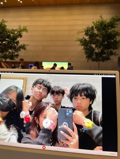 a group of people taking pictures on a computer screen