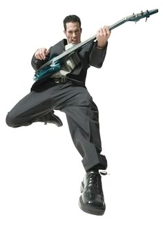 a man jumping in the air while holding a guitar stock - fotor / getty images