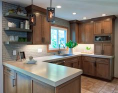 a kitchen with wooden cabinets and white counter tops