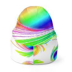 a beanie hat with multicolored feathers on the front and side, sitting against a white background