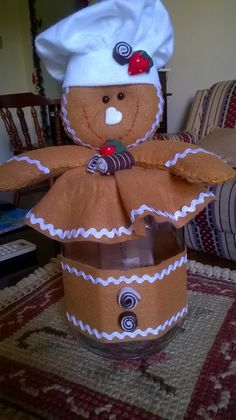 a gingerbread man in a chef's hat made out of cardboard