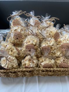 a basket filled with lots of popcorn sitting on top of a table