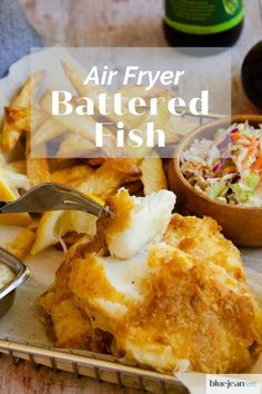 an air fryer battered fish with fries and coleslaw