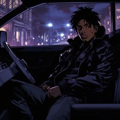 a man sitting in the driver's seat of a car at night