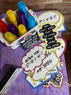 some stickers and markers on a purple table