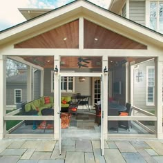 an outdoor living area with glass doors and patio furniture