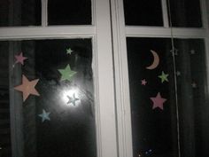 stars and moon stickers are on the window sill