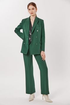 This Deluc Sophia Blazer is a stylish and sophisticated addition to your wardrobe. The double breasted blazer is crafted from a polyester-rayon blend in a bold pine green hue and features an oversized fit. The model is wearing an XS. Luxury Green Blazer With Double Button Closure, Green Double-breasted Blazer With Notch Lapel, Green Single Breasted Button-up Blazer, Tailored Single-breasted Green Blazer, Double-breasted Green Blazer With Double Button Closure, Pine Green, Breasted Blazer, Double Breasted Blazer, The Model