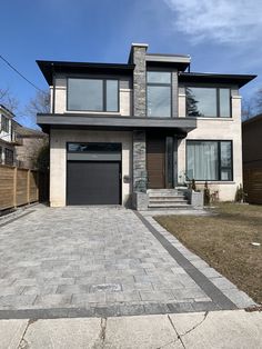 a house that has a driveway in front of it