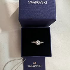 Swarovski Crystal Attract Ring Size 5.5. Brand New With Tag. Offers Welcome! See Our Photos For Details. Item #05759862 From Swarovski, This Ring Features: Swarovski's Attract Round Ring Is A Truly Romantic Gift. This Stunning, Rhodium-Plated Ring Features A Round Crystal In The Center With Sparkling Crystals On Either Side. The Crystals Embellish The Front Half Of The Ring. The Perfect Jewelry Piece For Day Or Evening Outfits! Rhodium-Plated Metal Swarovski Crystal Swarovski Promise Ring, Dainty Wedding Ring Silver, Swarovski Ring Aesthetic, Swarosky Jewelry Aesthetic, Swarovski Ring Engagement, Swarovski Jewelry Aesthetic, Swarovski Rings, Girlfriend Proposal, Graduation Ring