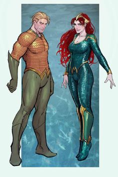 two people dressed as mermaids standing next to each other, one in blue and the other in green