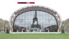 the eiffel tower is reflected in the glass windows of this building's front entrance