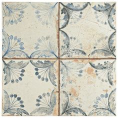 four tiles with blue and white floral designs on the sides, all in different sizes