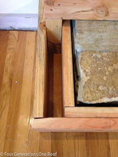 an open drawer in a wood floored room