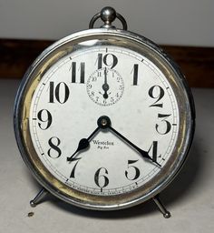 an alarm clock sitting on top of a table