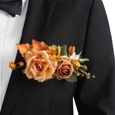 a man in a tuxedo with two orange roses on his lapel cover