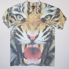 a t - shirt with an image of a tiger's mouth and teeth on it