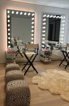 a living room filled with lots of furniture and lights on the wall above it's mirror