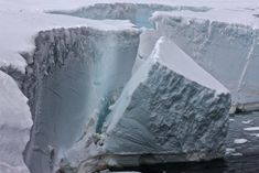 an iceberg that is partially submerged in the water and has been cut off from it's sides