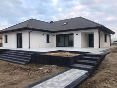 a house that is under construction with steps leading up to it