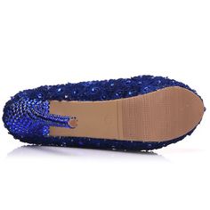 a pair of blue shoes with sequins on them