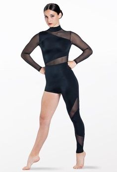 a woman in a black bodysuit with sheer mesh on the sleeves and legs