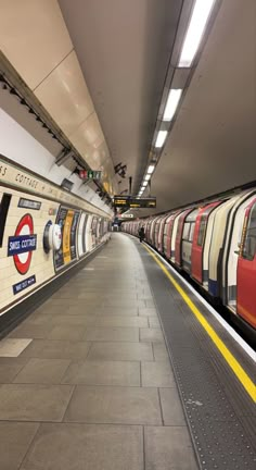 a subway train pulling into the station with its doors open