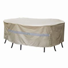 an outdoor table with a cover on it