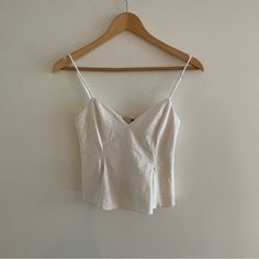 Cute Little White Zara Top -Perfect White Zara Top Brand New -I Feel Like It’s Cute For Going Out -Perfect Condition -Size Xs Feminine White Camisole Crop Top, White Fitted Summer Camisole, Elegant White Linen Tank Top, White Fitted Camisole For Summer, White Fitted Feminine Tank Top, Elegant White Cotton Tank Top, White Cotton Chic Camisole, Chic White Camisole Crop Top, Chic White Cotton Camisole