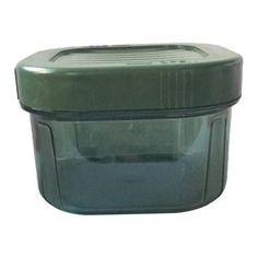 a green plastic container with a lid