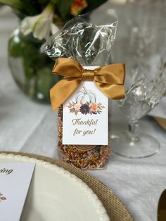 there is a jar with some kind of candy in it on top of the table