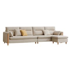 a white couch with pillows on it and a wooden frame around the armrests