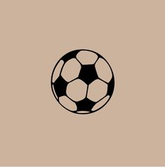 a black and white soccer ball on a brown background