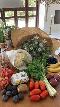 an assortment of fruits and vegetables on a table