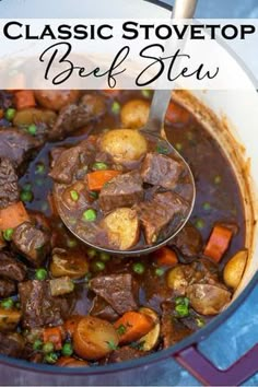 beef stew with potatoes and carrots in a white bowl on a blue table cloth