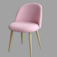 a pink chair with wooden legs on a gray background