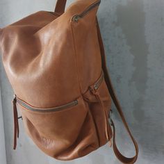 This stunning backpack is made of genuine soft nappa leather in a soft and distressed Honey Brown color. With enough room for all your daily essentials, It is perfect for everyday use, as well as for laptops of all sizes, IPAD, A4 files, books and travel. it as a unique structured with a zipper closure at the top, and three outside zipper pockets for mobile, keys, etc. It is fully lined with black strong cotton fabric which I divide to two large interior, zip pocket, and a leather cell phone poc Leather Backpack For Everyday Use, Soft Leather Softback Backpack For On-the-go, On-the-go Soft Leather Softback Backpack, Softback Soft Leather Backpack For Everyday Use, Leather Softback Backpack For On-the-go, Leather Softback Backpack With Zipper Closure, Brown Leather Backpack With Waxed Finish For Everyday, Everyday Softback Soft Leather Backpack, Everyday Leather Backpack With Leather Backing