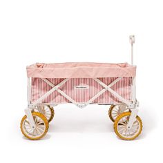 a pink and white baby's carriage with wheels on the bottom, in front of a white background