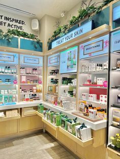 the inside of a skin care store with shelves full of products and signs on display