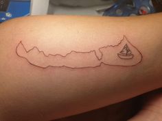 a woman's arm with a small tattoo of the state of virginia on it