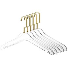 six gold and clear plastic hangers on a white background with clippings in the middle