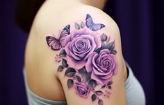 a woman's shoulder with pink roses and butterflies on her left arm, in front of a purple curtain