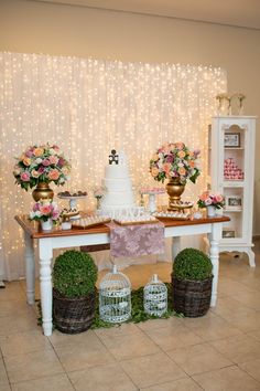 a table with flowers and cakes on it