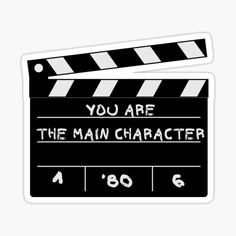 a movie clapper with the words you are the main character on it sticker