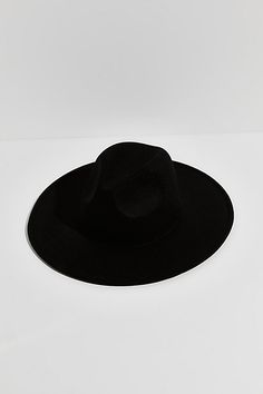 So simple yet chic, this effortlessly cool hat is featured in a structured style and soft wool-blend with a teardrop-shaped crown and wide brim. | Clean Slate Felt Hat by Free People in Black Modern Fedora Hat For Fall, Modern Curved Brim Felt Hat For Fall, Modern Felt Hat With Curved Brim For Fall, Modern Wide Brim Felt Hat For Winter, Chic Felt Hat With Curved Brim, Modern Fedora Felt Hat For Winter, Modern Felt Fedora Hat For Winter, Chic Wool Felt Hat For Spring, Modern Winter Fedora Felt Hat