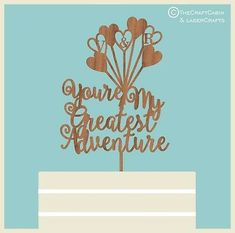 a cake topper that says, your my greatest adventure with hearts and flowers on it