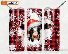 two red and black christmas themed tumbles with the image of a cow wearing a santa hat