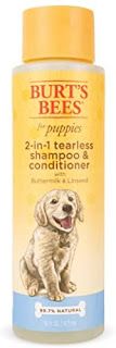 a bottle of dog shampoo for puppies with 2 - in - 1 tearless shampoos and conditioner